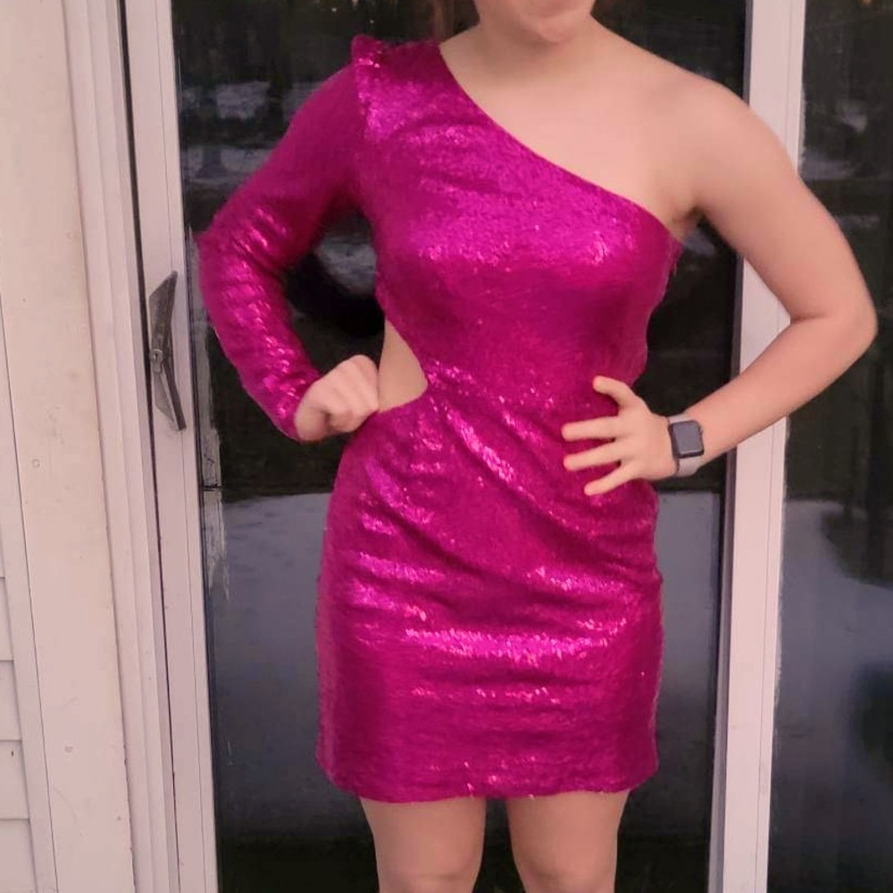 dress from Windsor it’s pink sequence and one shoulder cut out around waistline